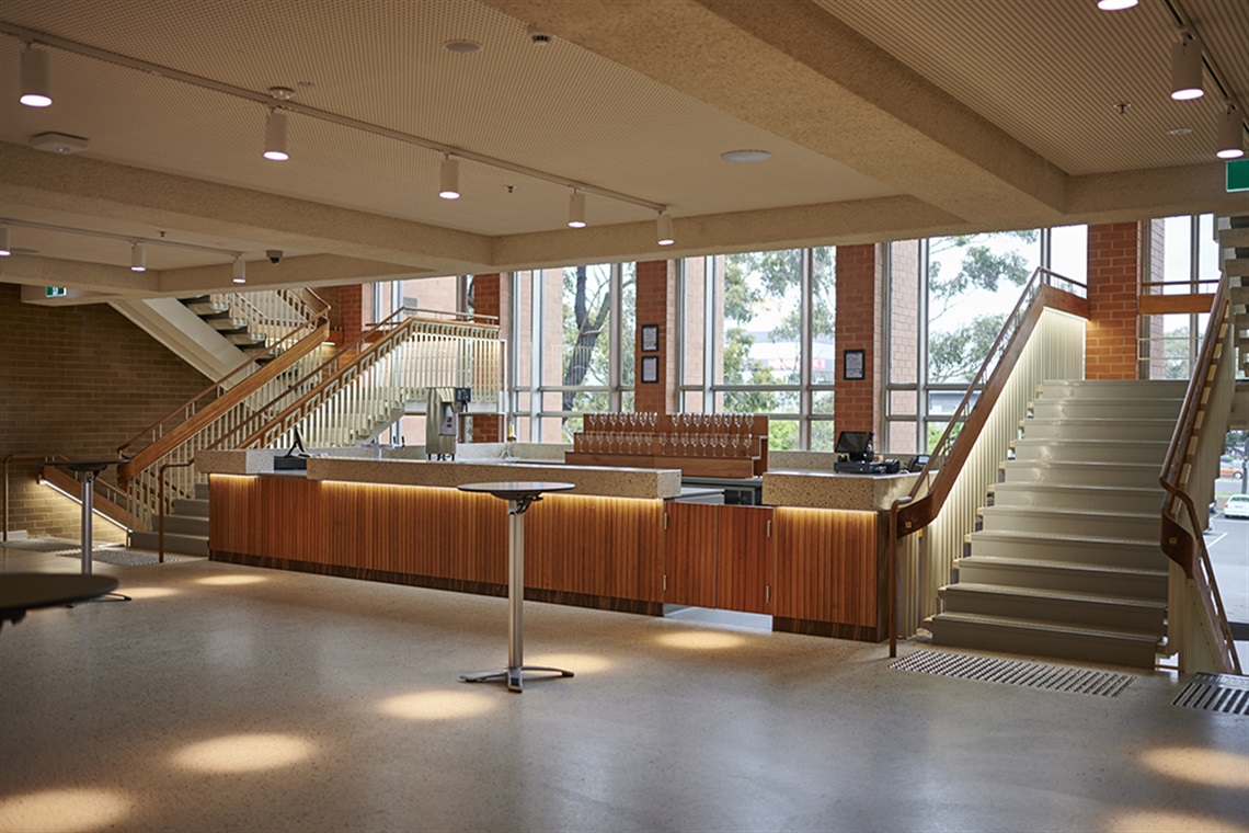 View of a bar between two staircases